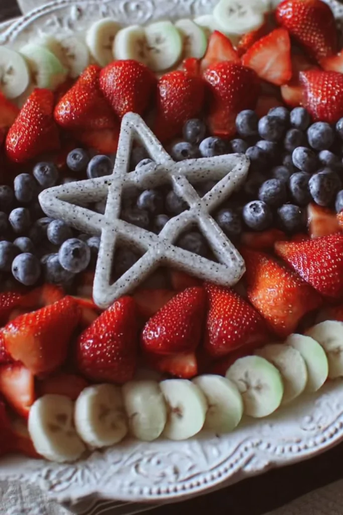Colorful flag fruit tray with assorted fresh fruits for celebrations.