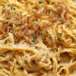 Delicious French Onion and Browned Butter Pasta dish garnished with herbs.