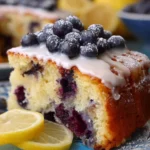 Gluten Free Lemon Blueberry Cake with vibrant blueberries and a lemon glaze