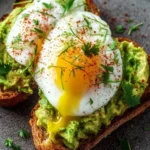 Gourmet avocado toast topped with a perfectly cooked egg