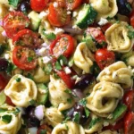 Delicious Greek Tortellini Pasta Salad with fresh vegetables and olives
