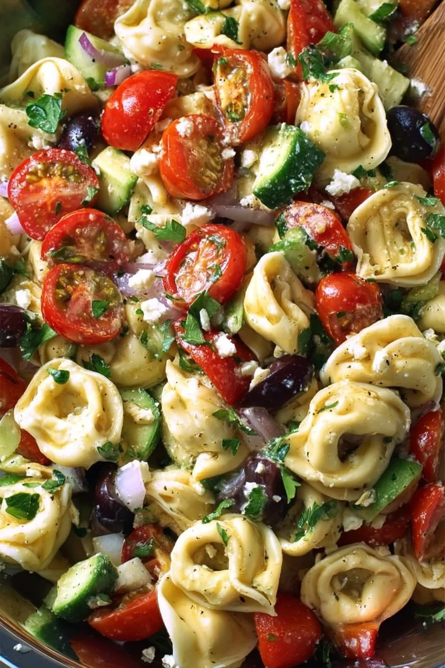 Delicious Greek Tortellini Pasta Salad with fresh vegetables and olives