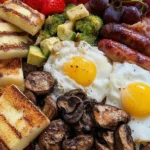 Grilled breakfast medley with fresh vegetables and eggs on a plate