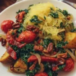 A colorful and healthy vegan dinner plate featuring fresh vegetables and grains.