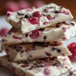 High protein frozen yogurt bark topped with fresh fruit and nuts
