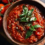 Bowl of homemade fresh tomato marinara sauce with herbs and spices