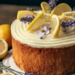 A beautifully decorated Lemon Lavender Cake with vibrant yellow frosting and lavender sprigs.