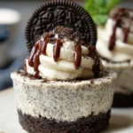 Gluten-free and dairy-free mini Oreo cheesecakes topped with Oreo cookies