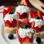 Mini Shortcake Cups topped with fresh strawberries and whipped cream