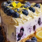 Delicious no-bake lemon blueberry cheesecake topped with fresh blueberries.