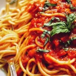 Delicious homemade Pasta Tomato Sauce served with fresh pasta.