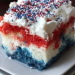 Patriotic Poke Cake decorated for the 4th of July, featuring red, white, and blue colors