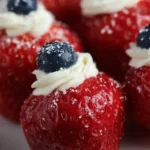 Patriotic stuffed strawberries filled with cream and decorated for celebrations