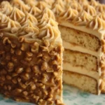 Delicious Peanut Butter Layer Cake with peanut topping