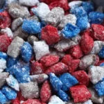 Red White and Blue Puppy Chow snack mix decorated for patriotic celebrations.