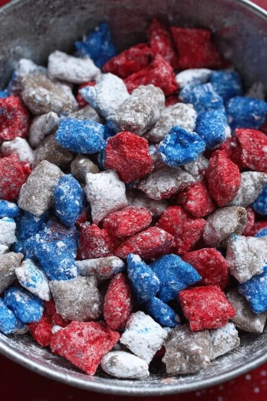 Red White and Blue Puppy Chow snack mix decorated for patriotic celebrations.