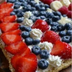 Colorful Sugar Cookie Flag Fruit Pizza topped with fresh fruits for a festive treat