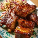 Slow-cooker teriyaki ribs served with vegetables and rice