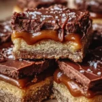 Delicious Twix Cookie Bars with caramel and cookie layers